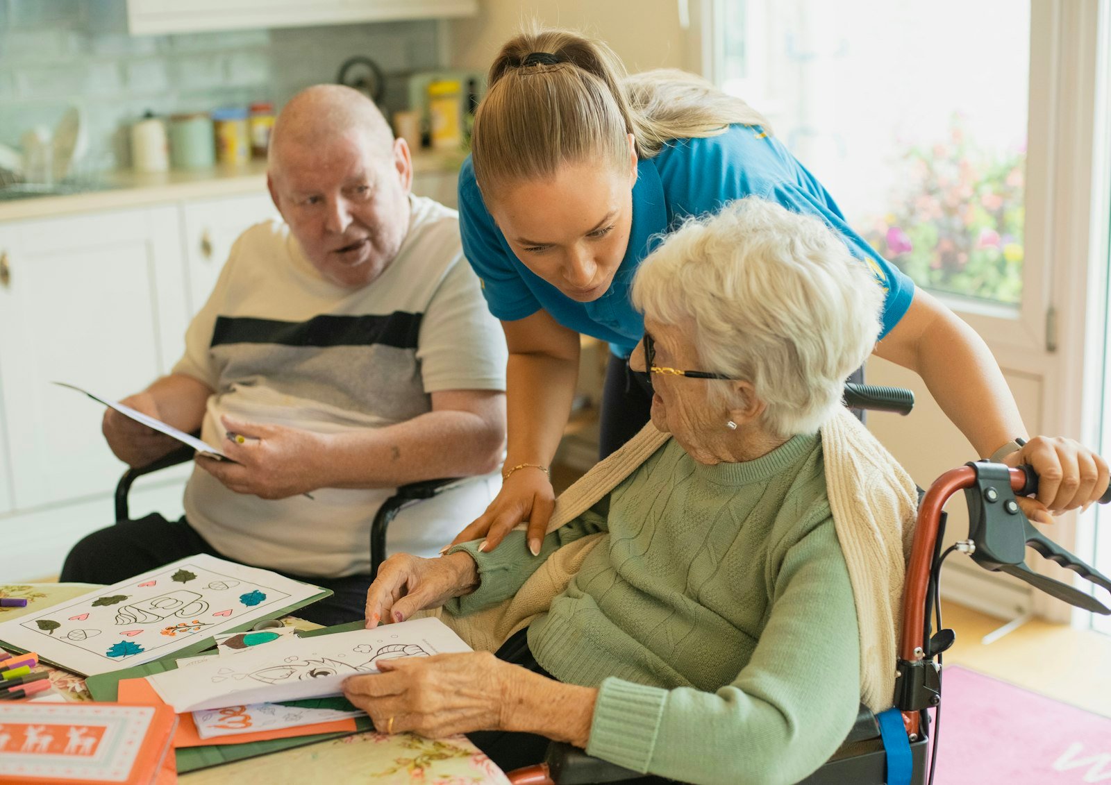 A caregiver warmly assisting an older passenger